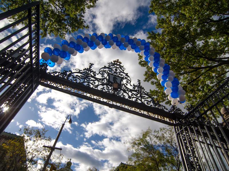 Shows view looking up at sky from Barnard gate. shows balloon arch on top of gate